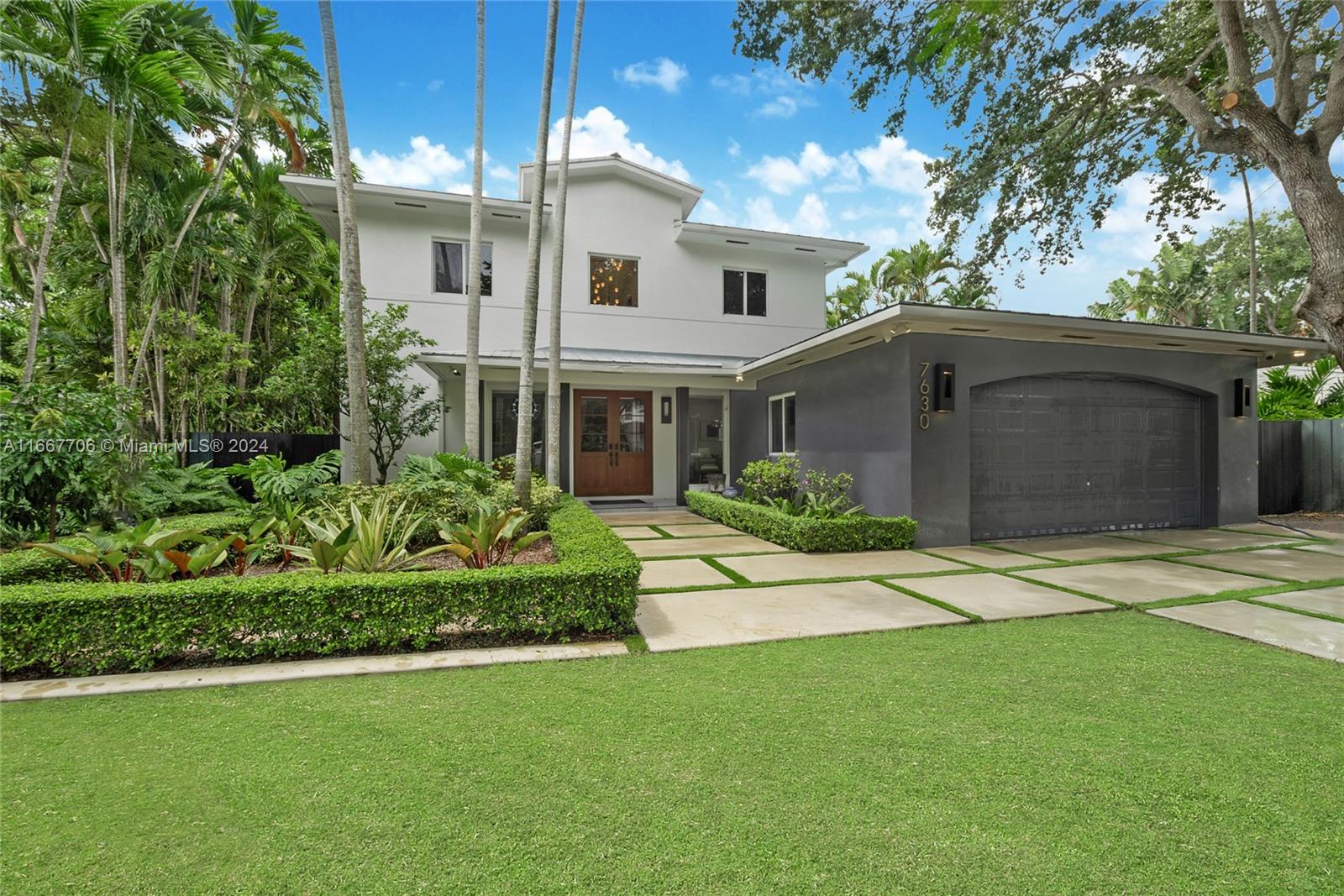 Completely renovated in 2022, nestled among mature trees on a quiet South Miami street w/in close proximity to shops, restaurants & more. Light filled foyer leads to spacious living areas, spectacular gourmet kitchen w/top of the line appliances, custom cabinetry & quartz countertops. Step outside to your private oasis w/ a covered patio overlooking the glistening pool & tropical garden w/lush landscaping, exotic trees & vegetable garden. 2 bedrooms on the first level, 2 additional bedrooms & the primary suite on the 2nd level, all w/en suite baths & walk in closets. Modern & elegant finishes through out, other features include custom cabinetry & built in's, walnut doors, sleek bathrooms, laundry room, 2 car garage w 2 EV charger2, automated blinds, infra-red sauna & smart home technology.