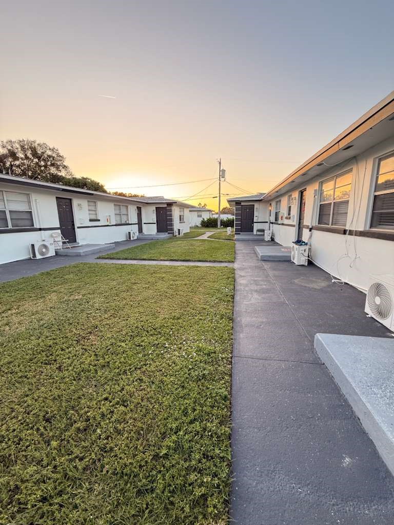Exterior view of a multi-unit property featuring w
