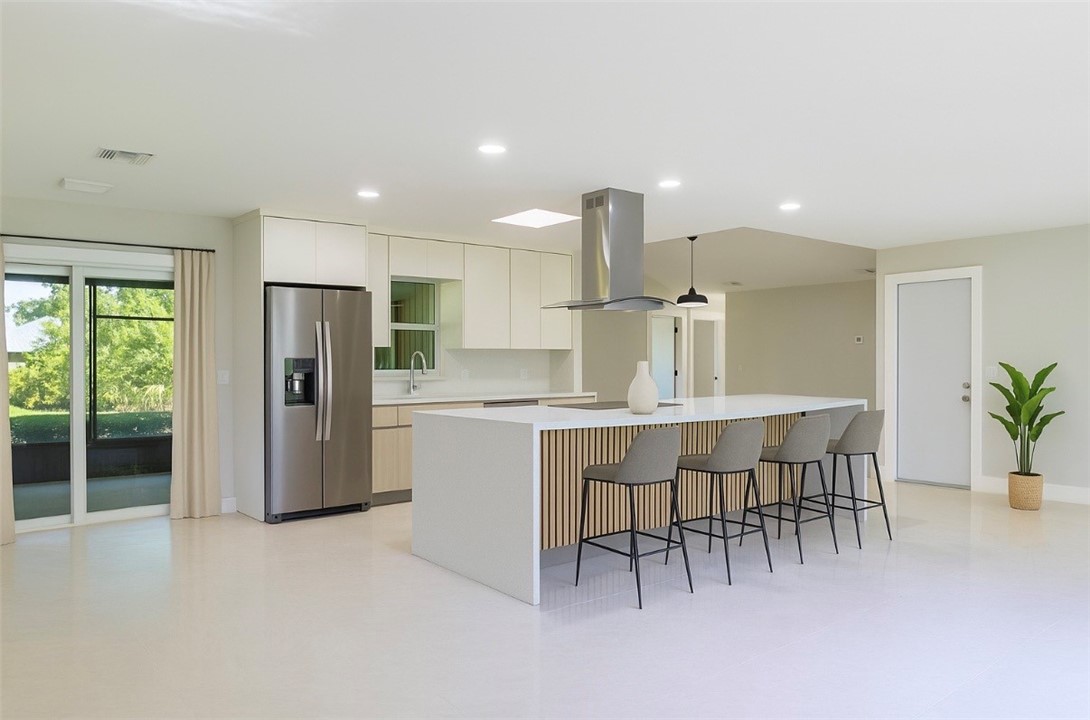 Kitchen featuring modern cabinets, stainless steel