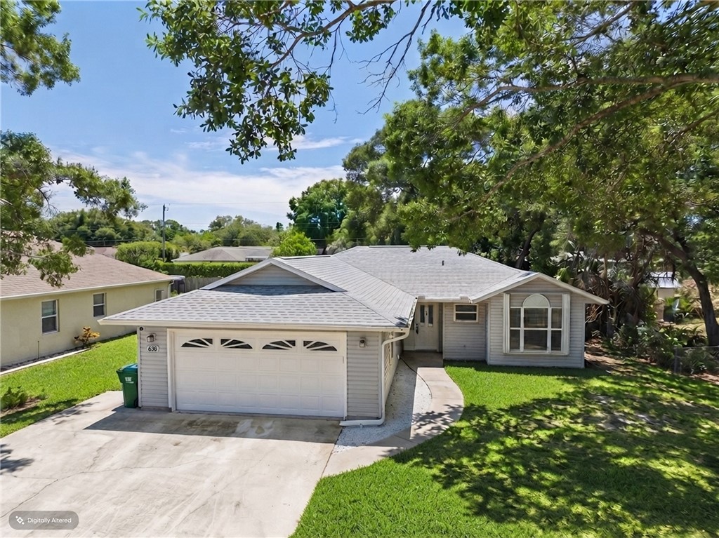 Single-story residence featuring light-colored sid