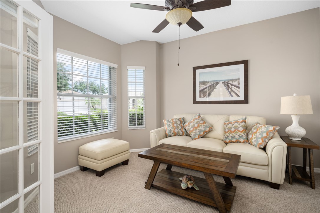Carpeted interior room featuring a modern ceiling
