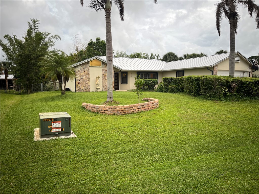 View of front facade featuring stone siding, stucc