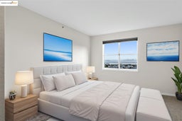 Bedroom featuring carpet and baseboards