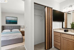 Bedroom featuring baseboards and a sink