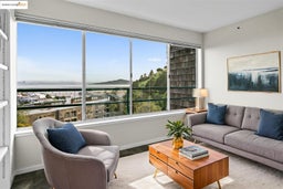Living area with plenty of natural light and a water view