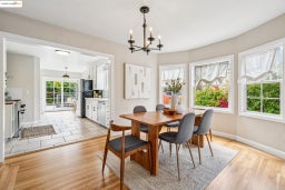 Dining area with a chandelier and light wood finished floors