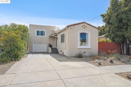 Mediterranean / spanish-style house with stucco siding, an attached garage, and concrete driveway