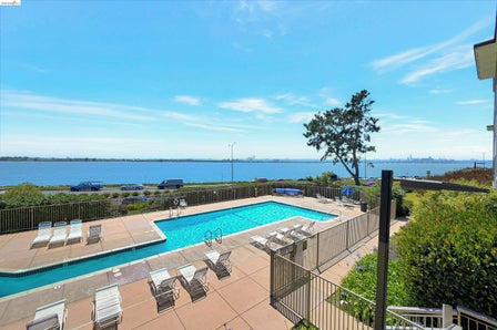 Outdoor swimming pool with integrated sun ledge