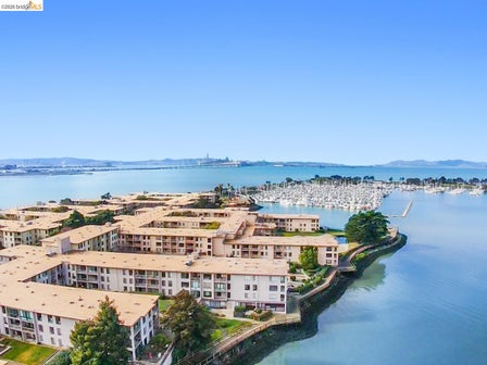 Waterfront multi-story buildings featuring private balconies and extensive water frontage