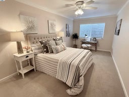 Oversized 2nd bedroom or office with room for both bedroom furniture and office furniture.