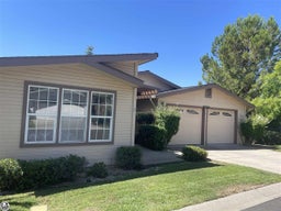 View of front facade with a front yard and a garage