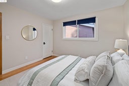 Bedroom featuring baseboards and wood finished floors