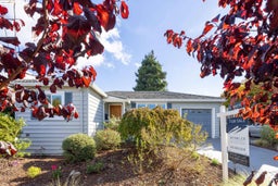 Ranch-style home featuring an attached garage and concrete driveway