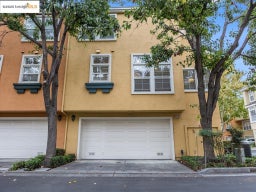 View of front of home with stucco siding and a garage