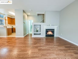 Unfurnished living room with a glass covered fireplace, light wood-type flooring, and recessed lighting