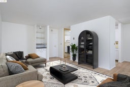 Living area with light wood-type flooring and baseboards