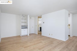 Unfurnished living room featuring light wood-style flooring
