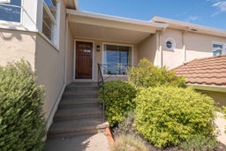 Entrance to property with stucco siding