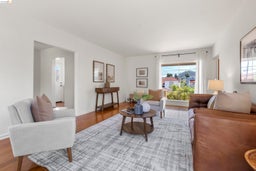 Living area featuring wood finished floors and baseboards