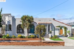 Mediterranean / spanish-style house featuring driveway and stucco siding