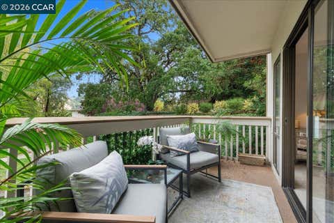 Photo of 1317 Canyonwood Ct #4, Walnut Creek, CA 94595 (MLS # 41139605)