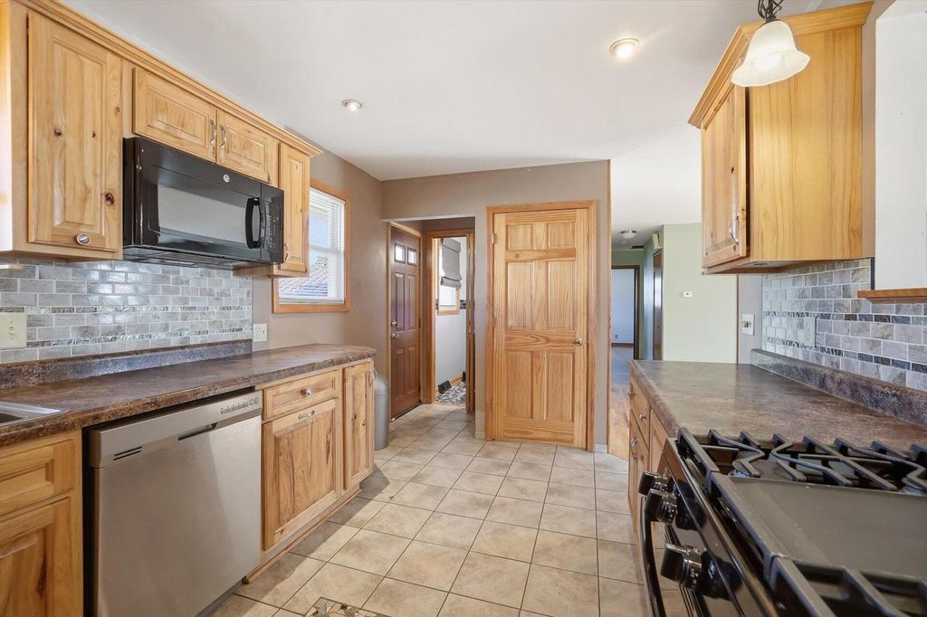 Photo of 9320 W Howard AVENUE, Milwaukee, WI 53228 (MLS # 1944164)