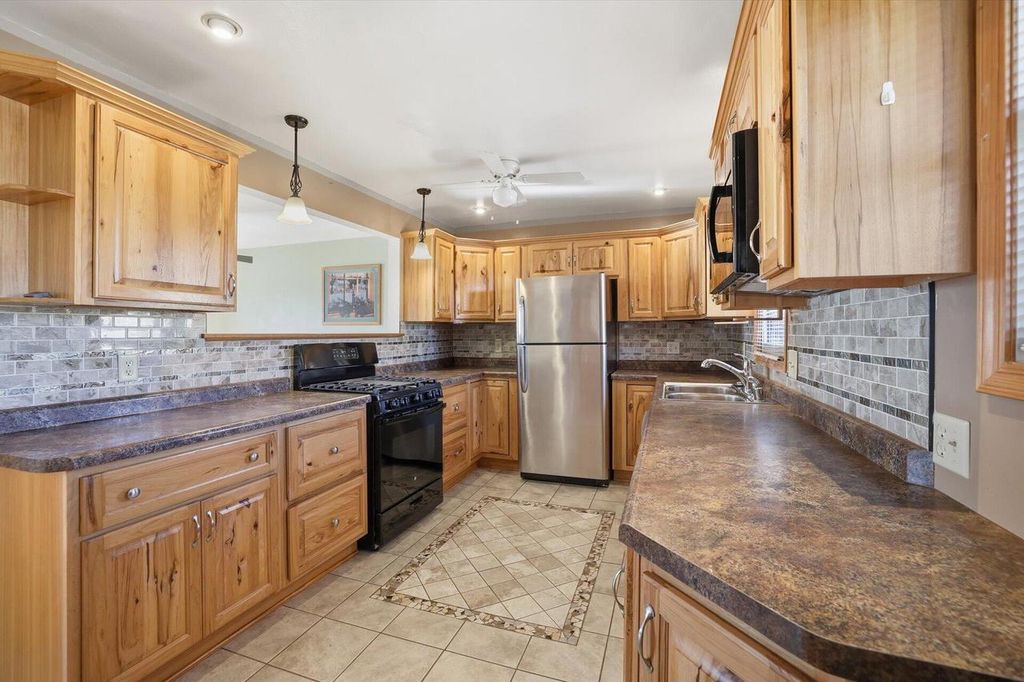 Photo of 9320 W Howard AVENUE, Milwaukee, WI 53228 (MLS # 1944164)