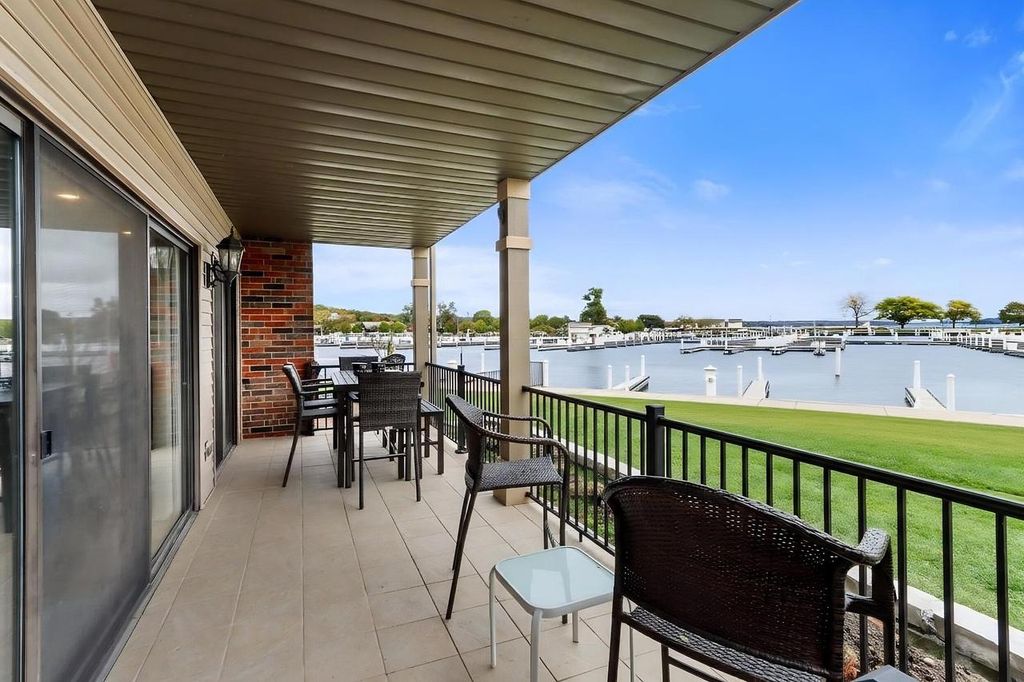 Photo of 12 Abbey Villa CIRCLE #C, Fontana, WI 53125 (MLS # 1941612)