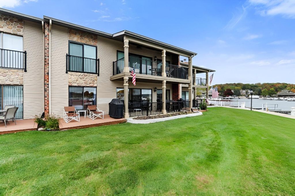 Photo of 12 Abbey Villa CIRCLE #C, Fontana, WI 53125 (MLS # 1941612)