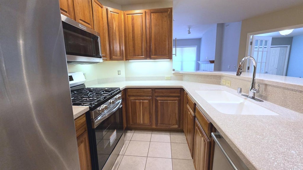 Photo of 360 W Washington AVENUE #215, Madison, WI 53703 (MLS # 2031554)