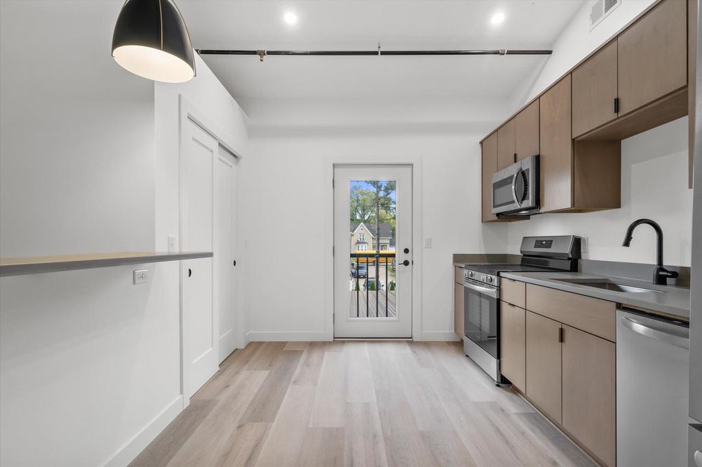 Photo of 308 Oak STREET #201, Slinger, WI 53086 (MLS # 1947410)