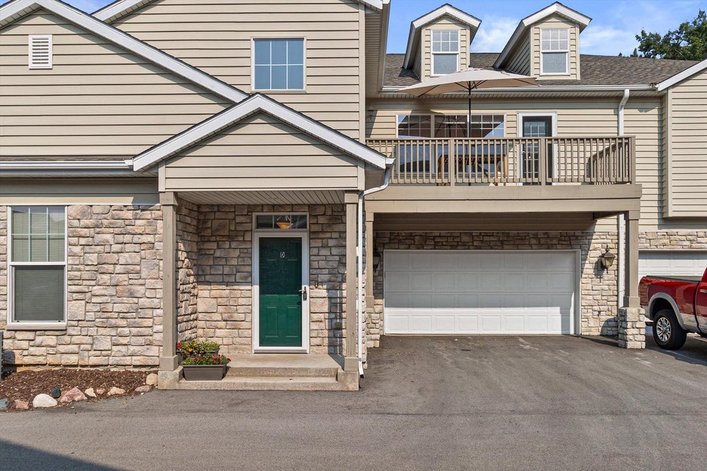 Photo of N16W26401 Meadowgrass CIRCLE #D, Pewaukee, WI 53072 (MLS # 1973888)