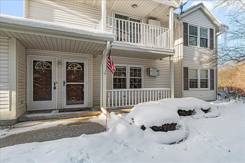 Photo of 831 Devonshire LANE #D, West Bend, WI 53090 (MLS # 1944599)