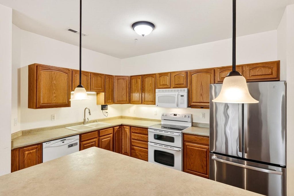 Photo of 100 Femrite DRIVE #106, Monona, WI 53716 (MLS # 2031774)