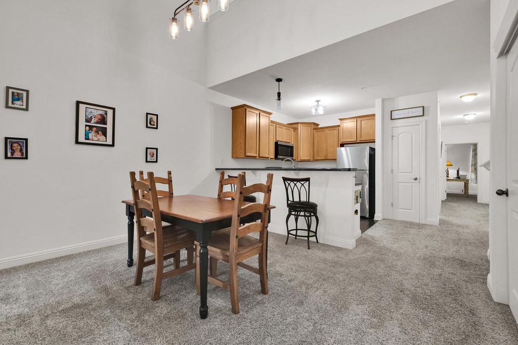 Photo of 2030 Rainbow Lake LANE #323, West Bend, WI 53090 (MLS # 1947975)