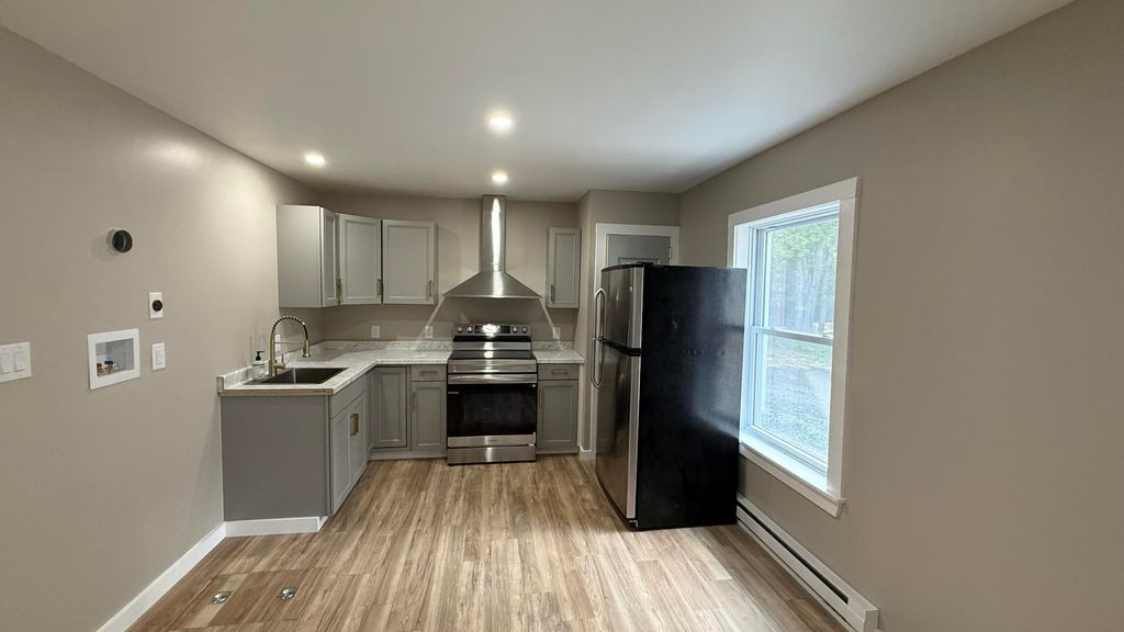 Photo of 303 Main Road, Milford, ME 04461 (MLS # 1649143)