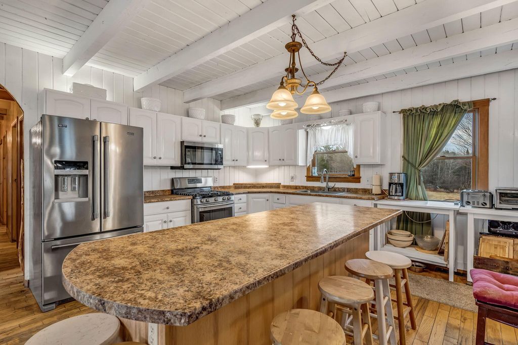 Photo of 54 Folsom Ridge Road, Burlington, ME 04417 (MLS # 1657588)