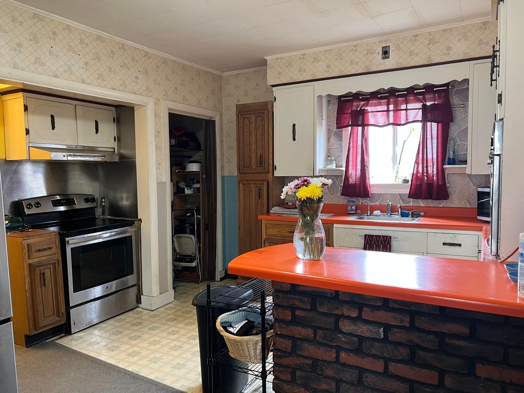 Photo of 63 Rideout Avenue, Lewiston, ME 04240 (MLS # 1659773)