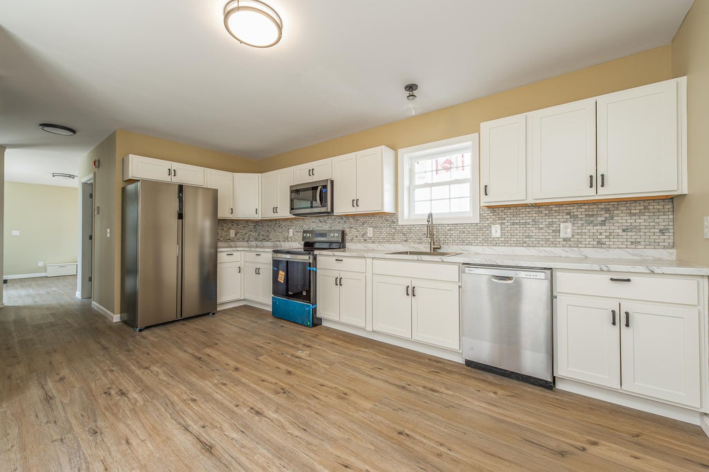 Photo of 27 Drummond Street, Auburn, ME 04210 (MLS # 1673174)