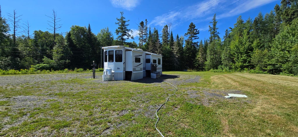 Photo of 3563 Caribou Road, Cross Lake Twp, ME 04779 (MLS # 1675580)
