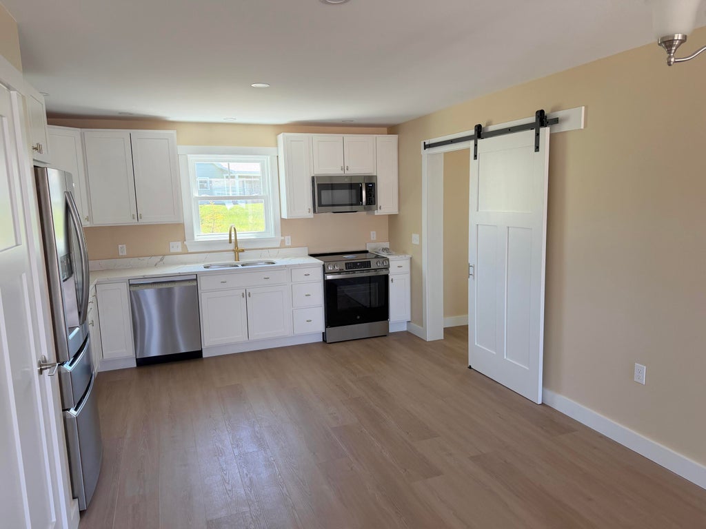 Photo of 25 Tinker Meadow Way #9, Ellsworth, ME 04605 (MLS # 1684240)