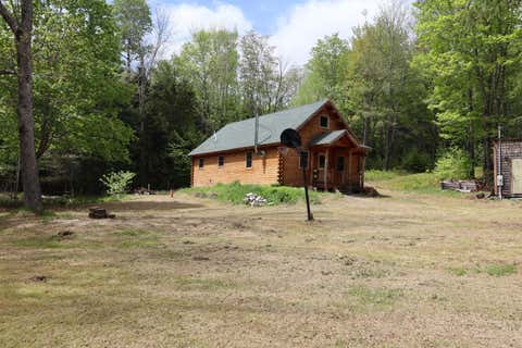 Photo of 198 Scammon Road, Greenville, ME 04441 (MLS # 1665553)
