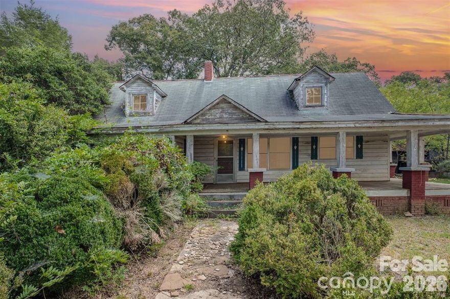 Embrace the charm of a bygone era in this captivating 1870 farmhouse, nestled on a peaceful 0.9-acre country retreat. This 2-bedroom, 1-bath home beckons you to step back in time and infuse it with your personal touch, making it an ideal investment property for Airbnb or long-term rental. 

Stepping inside this historic 1870 dwelling, you're greeted by the warmth of not one, but two fireplaces, one in the living room and another in the family room, adding a cozy ambiance to the layout. Opportunities abound to restore and personalize this vintage gem, it's a ready blank canvas for your vision.

The property's outdoor spaces invite you to savor the countryside views. A covered wrap around front and side porch, a screened side porch, a covered rear porch, and a covered left-side porch offer ample options for al fresco enjoyment. A circular driveway adds convenience and accessibility, welcoming you home. 

This countryside treasure from 1870 is brimming with potential, awaiting your restoration efforts to breathe new life into its charming character. It presents an excellent opportunity for Airbnb or long-term rental, allowing you to capitalize on the growing demand for unique, historic accommodations in North Carolina. Bring your imagination and transform this piece of history into your very own sanctuary or profitable investment.