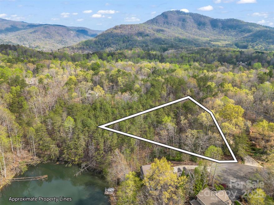 Positioned at the end of the cul-de-sac, this .69 acre lot in Shumont Estates provides enhanced privacy with only a limited number of neighboring properties. Walking distances to Shumont Lake, this lot offers an ideal blend of seclusion and accessibility. Residents of Shumont Estates have access to the extensive amenities at Rumbling Bald Resort. These include private beach access to Lake Lure, multiple hiking and biking trails, two championship golf courses, and various dining options including a Starbucks on site. The resort also offers wellness facilities such as a fitness center, sauna, and multiple swimming pools, enhancing the lifestyle of its community members.
