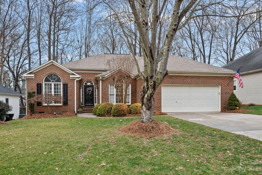 Inviting ranch-style home featuring 3 beds, 2 baths, office, and formal dining. 2-car garage with a convenient man door on the side for easy access to back yard.   Relax on the oversized deck or on the patio with fire pit area viewing the natural rock and tranquil creek.  Admire vibrant azaleas in spring and cozy up to the fire pit in fall. Open floor plan with split bedrooms. Impeccably cared for, showcasing well. Community amenities include pools, tennis courts, and play areas.

Minutes from shopping, schools and I-77 for easy commute to the city.