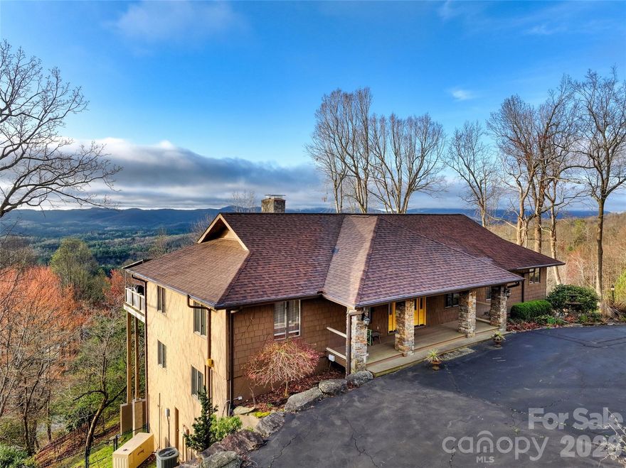 MOUNTAIN VIEWS AND ACTIVE SHORT TERM RENTAL! Welcome to Morning Glow — a breathtaking 3-bed, 3-bath home offering 180-degree, south-facing mountain views in the sought-after community of Laurel Park. Just 10 minutes from downtown Hendersonville, 1 mile from scenic Jump Off Rock, and a short drive to Asheville and the Asheville Regional Airport, this home perfectly balances convenience and mountain living. Designed for both comfort and entertainment, the open-concept living area showcases expansive views, abundant natural light, and a chef’s kitchen with high-end appliances. The large covered deck creates a seamless indoor/outdoor flow — ideal for relaxing or entertaining guests. Enjoy true main-level living with all primary spaces on one floor, plus a spacious den and full bath on the lower level with direct access to the oversized two-car garage. Outdoor enthusiasts will love the fully fenced backyard, perfect for pets and recreation, as well as the home’s proximity to the Ecusta Trail, excellent cycling routes, and countless outdoor activities in the Blue Ridge Mountains. Currently operating as a successful short-term rental with professional management that can easily transition to a new owner, Morning Glow is an exceptional opportunity — whether you’re seeking an investment property, vacation getaway, or full-time residence. Furnishings available as a separate purchase.