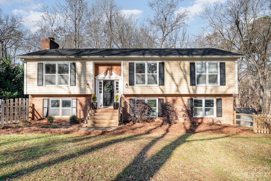 Welcome to 8127 Cliffside Drive, a property located in the heart of South Charlotte with proximity to many schools, and just 0.2 miles to McAlpine Creek Trails. This beautiful 4-bedroom, 3-full-bath home spans over 2500 square feet and is situated on an expansive half-acre lot. With two separate living rooms, there's ample space for both relaxation and entertainment. The large laundry room, strategically designed as a drop zone, adds convenience to your daily routine. One of the unique features of this home is the bonus room, currently utilized as a gym. The home has hardwoods throughout the entire house, replaced in 2020 and 2021. The kitchen has quartzite countertops and stainless steel appliances, perfect for entertaining guests. The primary bedroom is large and boasts a beautiful ensuite bathroom with dual vanities.