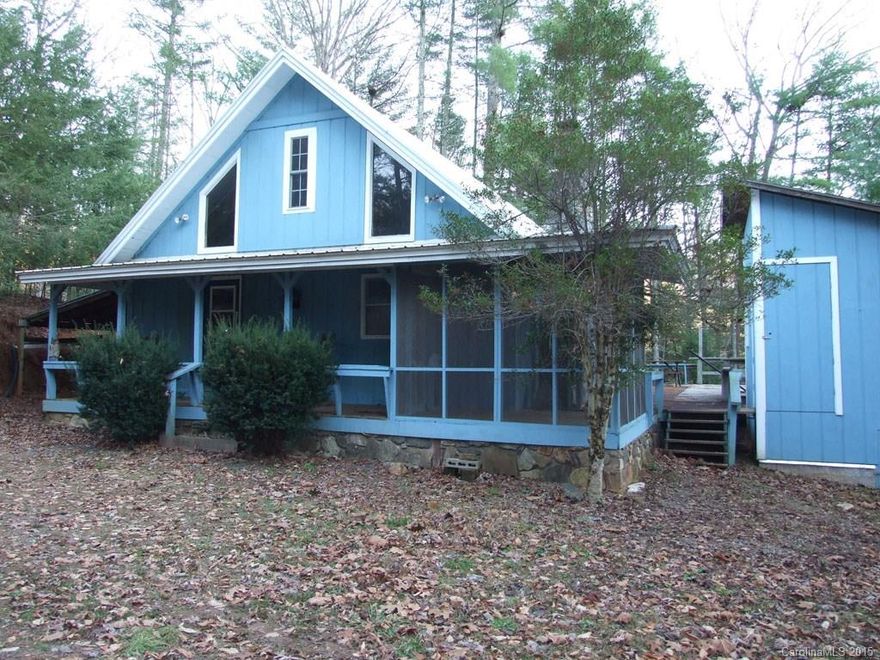 Handsome modified A-frame located in small mountain subdivision. Home features a lge stone fireplace, great room with soaring ceiling, kitchen with new appliances.  2 bedrooms with carpet and a loft area (not counted in SQ.FT.) with half bath (could be add'l BR or family room). Very large private deck & new workshop. 10 min to Burnsville, 40 min to AVL