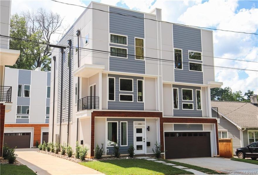 Mind Blowing 3 Story END UNIT Condo with ROOFTOP TERRACE & SKYLINE VIEWS. Walk to Pinky's, Blue Blaze Brewing, Burger Company and Rhino Market. READY TO MOVE IN RIGHT NOW! Only 1 mile from UPTOWN! Open spaces & MODERN DESIGN, SS Appliances, Krono swiss sustainable Floors, Wooden FLOATING STAIRS, Attached Front Load 2 Car GARAGE & much more!