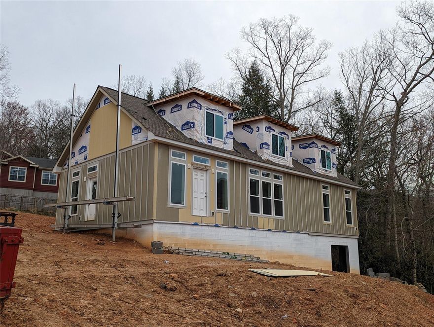 Motivated seller - bring an offer! Cape Cod home under construction in Black Mountain town limits! Price is for the home in its current condition (see photos) if buyer wants to bring their own contractor to finish it out. Price and photos will be updated as construction progresses. Buyer can also go under contract now and owner will finish to buyer's specs. Year-round mountain views from this off-the-beaten-path location with easy access to the Black Mountain Y, Creekside Racquet Club, downtown, and I-40. Listing specs are based on building plans (available in MLS). Actual specs may vary as construction continues. Upper level to have 2 more dormers installed to accommodate 2 bedrooms, a full bath, and a loft/office area. Primary bedroom on main level & open floorplan. Huge basement (ideal for storage or a workshop space). A detached garage could be added behind house. Additional .29 building lot next door is available (see MLS 4004498) or buy both parcels as a package (MLS 4004532).